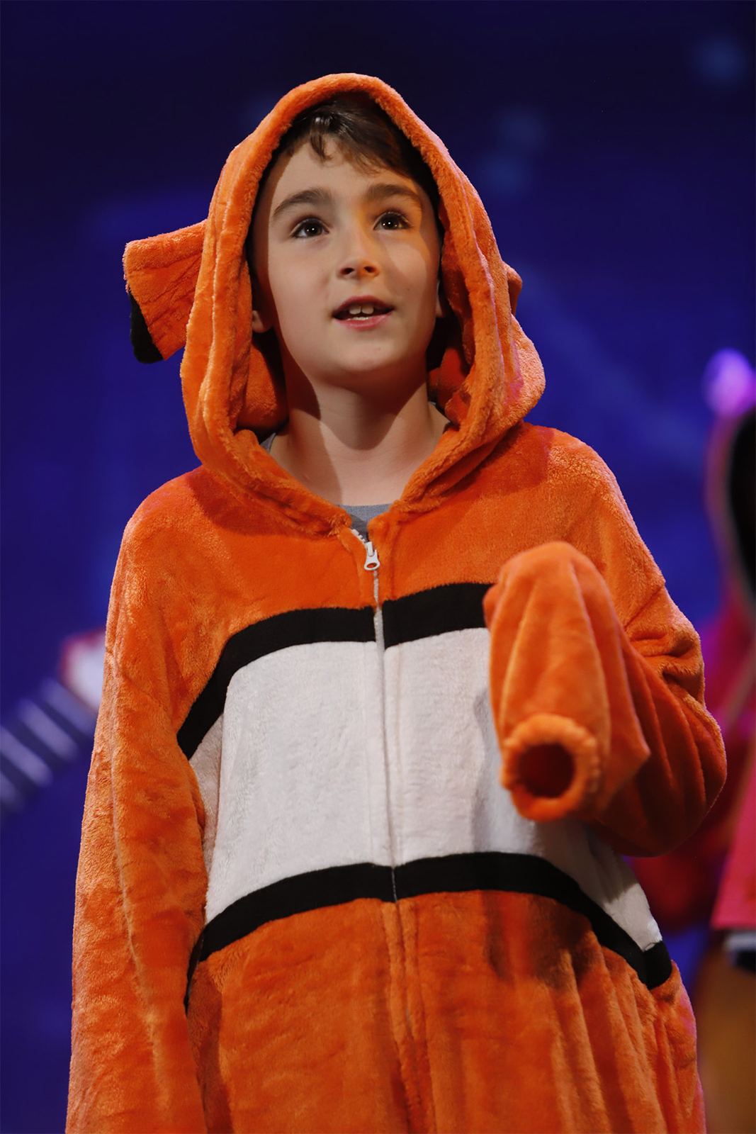 A young performer in an orange clownfish hoodie in Ocean’s Got Talent, Spring 2026